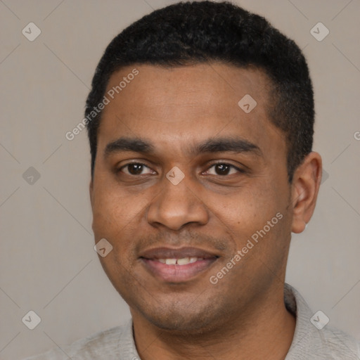 Joyful black young-adult male with short  black hair and brown eyes