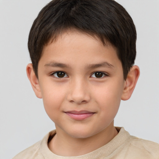 Joyful white child male with short  brown hair and brown eyes