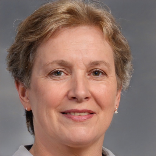 Joyful white middle-aged female with medium  brown hair and brown eyes