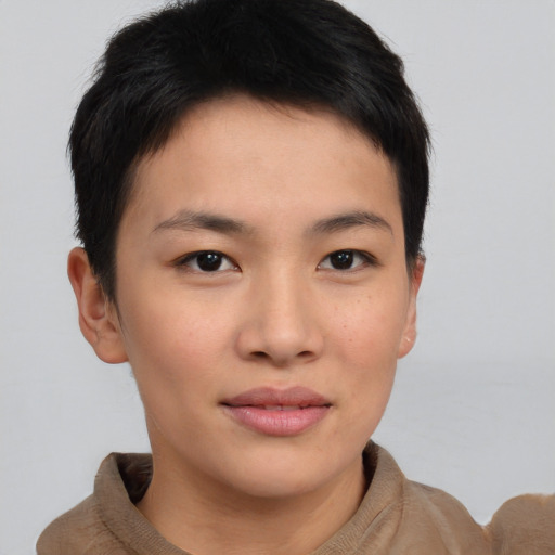 Joyful asian young-adult female with short  brown hair and brown eyes