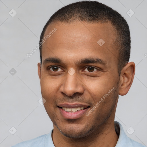 Joyful latino young-adult male with short  brown hair and brown eyes