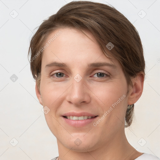 Joyful white young-adult female with short  brown hair and grey eyes