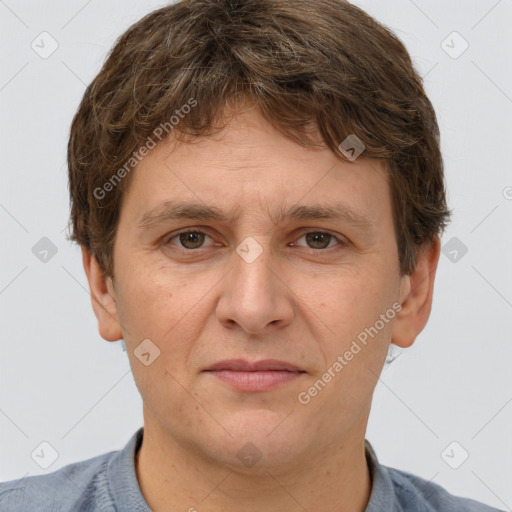 Joyful white adult male with short  brown hair and grey eyes