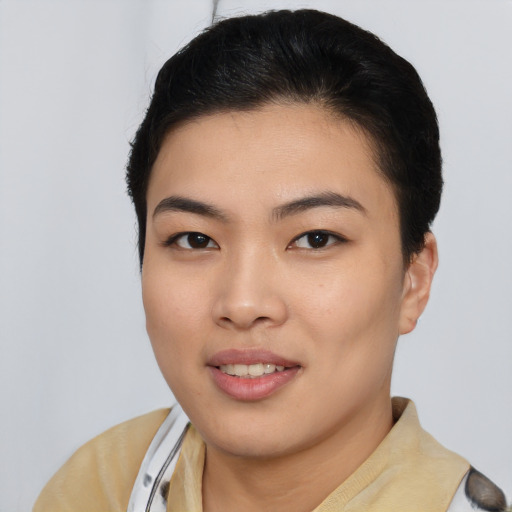 Joyful asian young-adult female with short  black hair and brown eyes