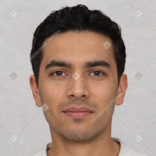 Neutral latino young-adult male with short  black hair and brown eyes