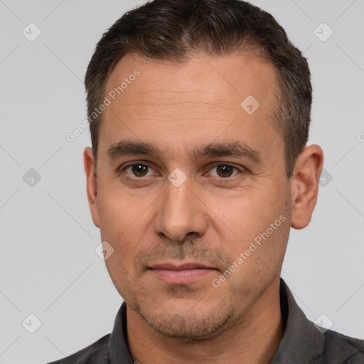 Joyful white adult male with short  brown hair and brown eyes