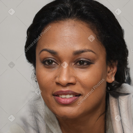 Joyful black young-adult female with long  black hair and brown eyes