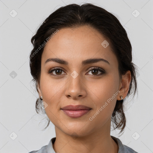 Joyful latino young-adult female with medium  brown hair and brown eyes