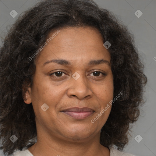 Joyful black adult female with medium  brown hair and brown eyes