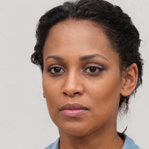 Neutral black young-adult female with short  brown hair and brown eyes