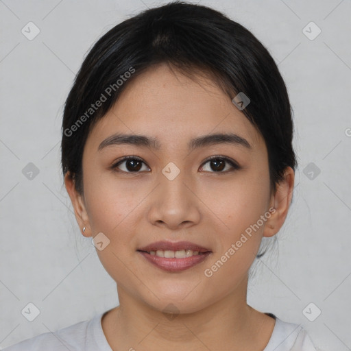 Joyful asian young-adult female with short  black hair and brown eyes