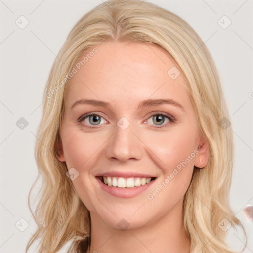 Joyful white young-adult female with long  brown hair and blue eyes