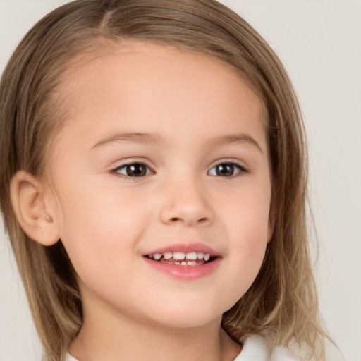 Joyful white child female with medium  brown hair and brown eyes