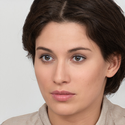 Neutral white young-adult female with medium  brown hair and brown eyes