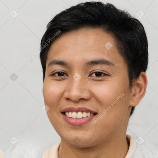 Joyful asian young-adult female with short  brown hair and brown eyes