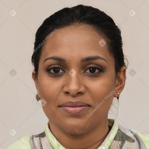 Joyful latino young-adult female with short  brown hair and brown eyes