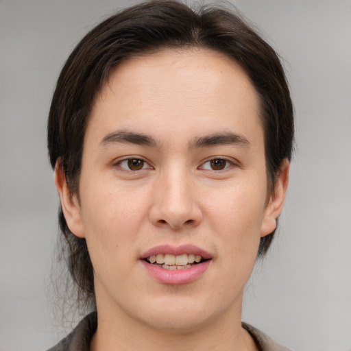 Joyful white young-adult male with medium  brown hair and brown eyes