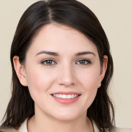 Joyful white young-adult female with medium  brown hair and brown eyes