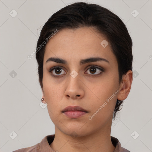 Neutral white young-adult female with short  brown hair and brown eyes