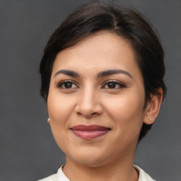 Joyful asian young-adult female with medium  brown hair and brown eyes