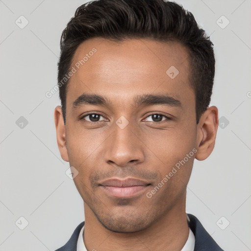 Joyful white young-adult male with short  black hair and brown eyes