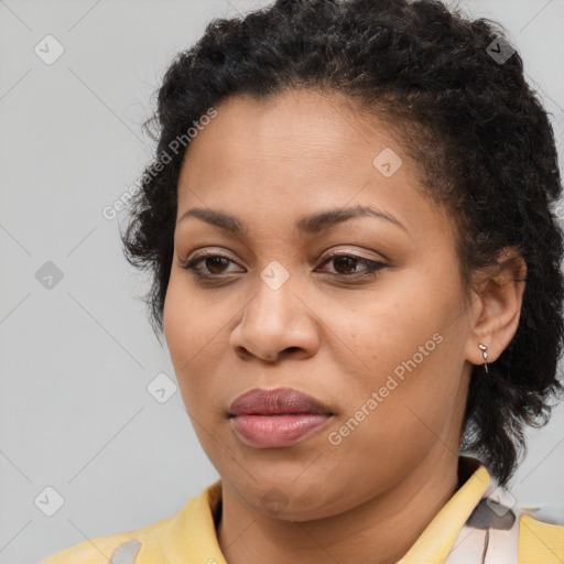 Joyful black adult female with short  brown hair and brown eyes