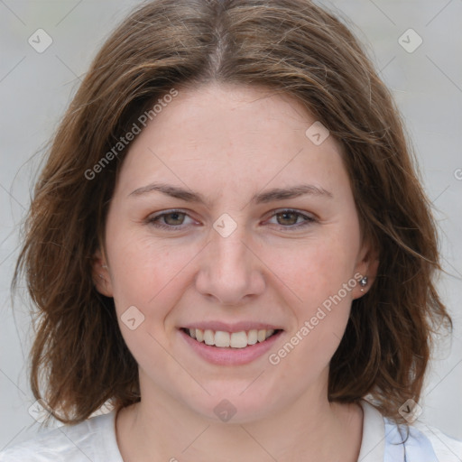 Joyful white young-adult female with medium  brown hair and blue eyes