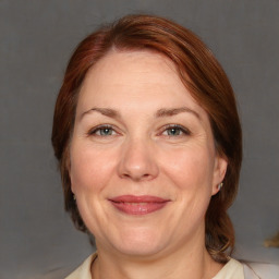 Joyful white adult female with medium  brown hair and grey eyes