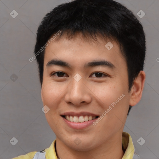 Joyful asian young-adult male with short  brown hair and brown eyes