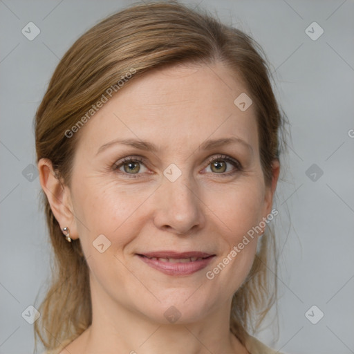 Joyful white adult female with medium  brown hair and grey eyes