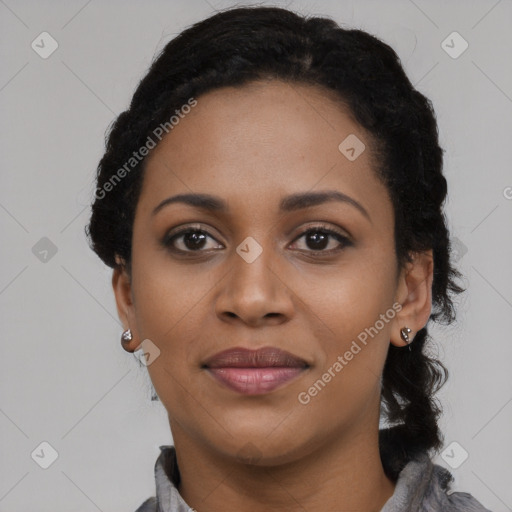 Joyful black young-adult female with long  black hair and brown eyes