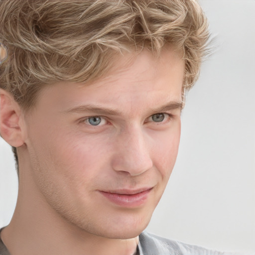 Joyful white young-adult male with short  brown hair and blue eyes