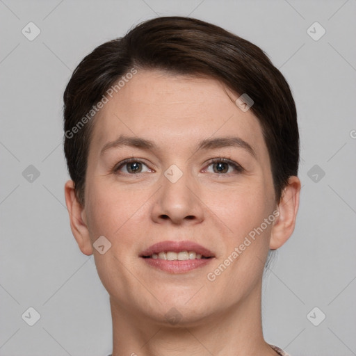 Joyful white young-adult female with short  brown hair and brown eyes