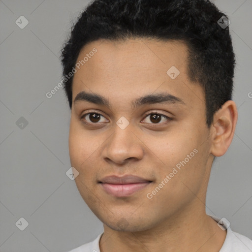 Joyful latino young-adult male with short  black hair and brown eyes