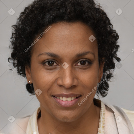 Joyful black adult female with short  brown hair and brown eyes