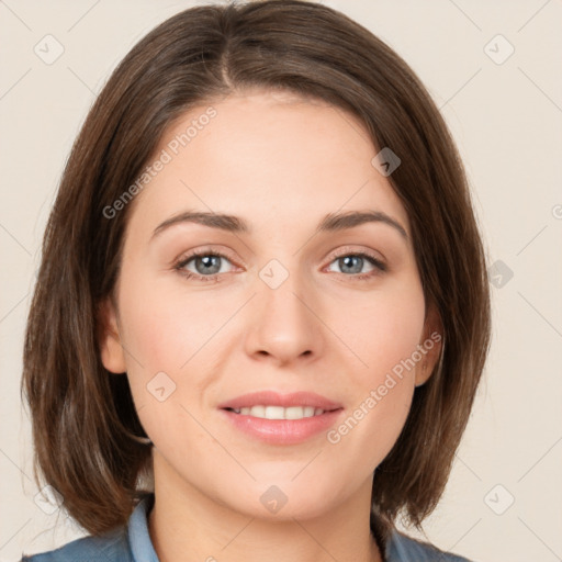 Joyful white young-adult female with medium  brown hair and green eyes