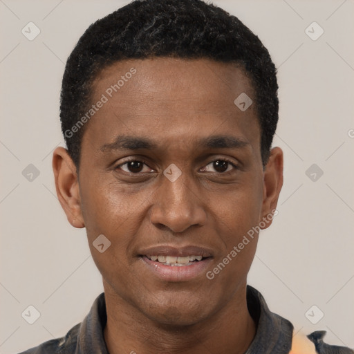 Joyful black young-adult male with short  black hair and brown eyes