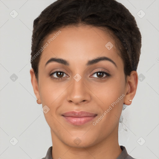 Joyful latino young-adult female with short  brown hair and brown eyes