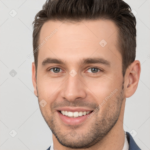 Joyful white young-adult male with short  brown hair and brown eyes