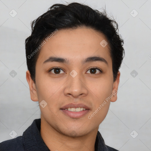 Joyful latino young-adult male with short  black hair and brown eyes