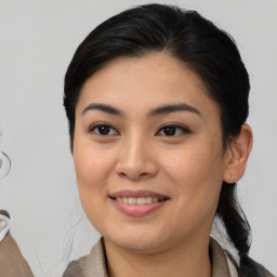 Joyful asian young-adult female with medium  brown hair and brown eyes