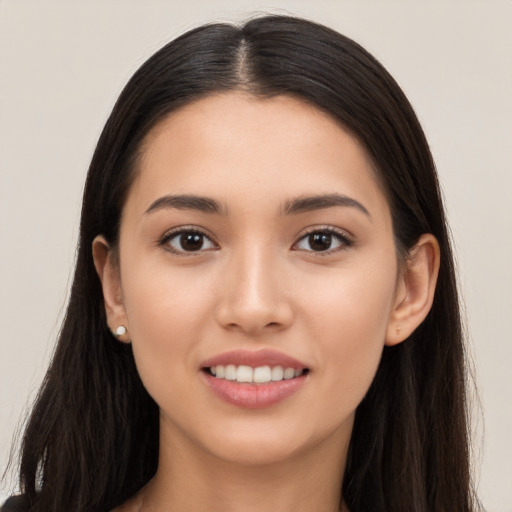 Joyful white young-adult female with long  brown hair and brown eyes