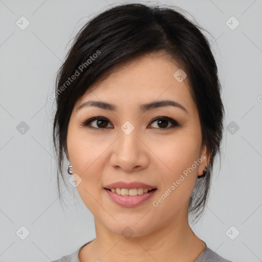 Joyful asian young-adult female with medium  brown hair and brown eyes