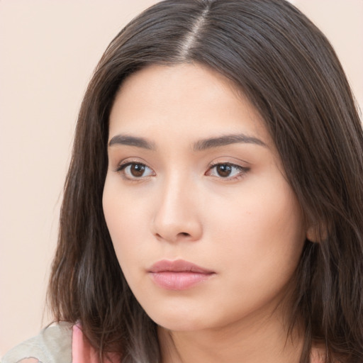 Neutral white young-adult female with long  brown hair and brown eyes