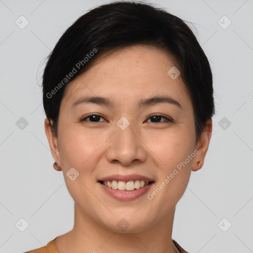 Joyful asian young-adult female with short  brown hair and brown eyes