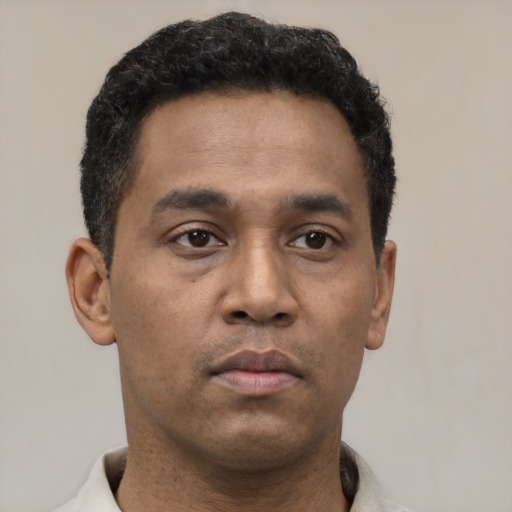 Neutral latino young-adult male with short  brown hair and brown eyes
