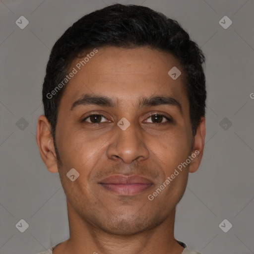 Joyful latino adult male with short  brown hair and brown eyes