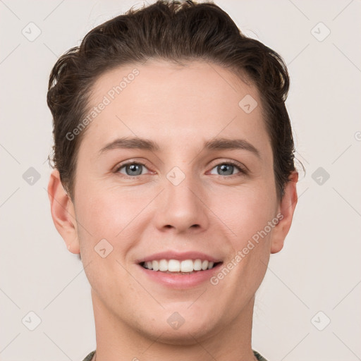 Joyful white young-adult female with short  brown hair and grey eyes