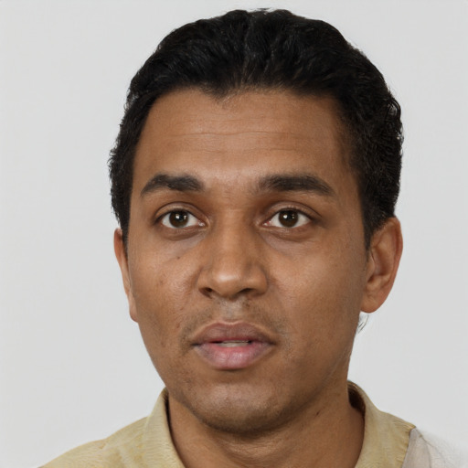 Neutral black young-adult male with short  black hair and brown eyes