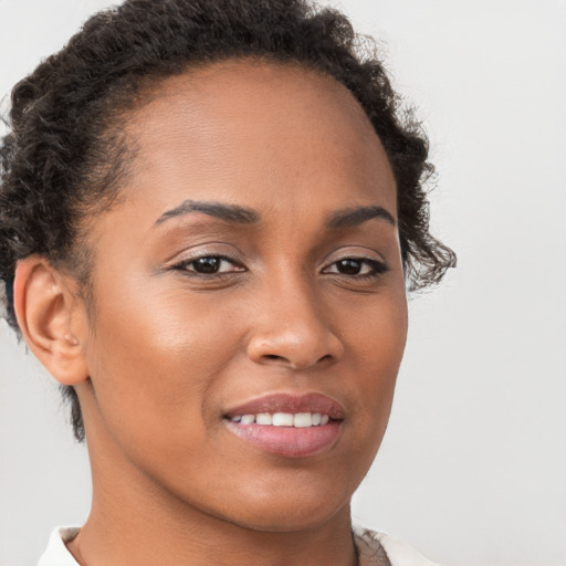 Joyful latino young-adult female with short  brown hair and brown eyes